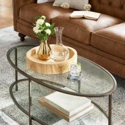 Home Decorators Collection Bella 46 in. Antique Bronze/Clear Large Oval Glass Coffee Table with Shelf -Home Decorators Soldes antique bronze home decorators collection coffee tables v183102xxb np 31 1000