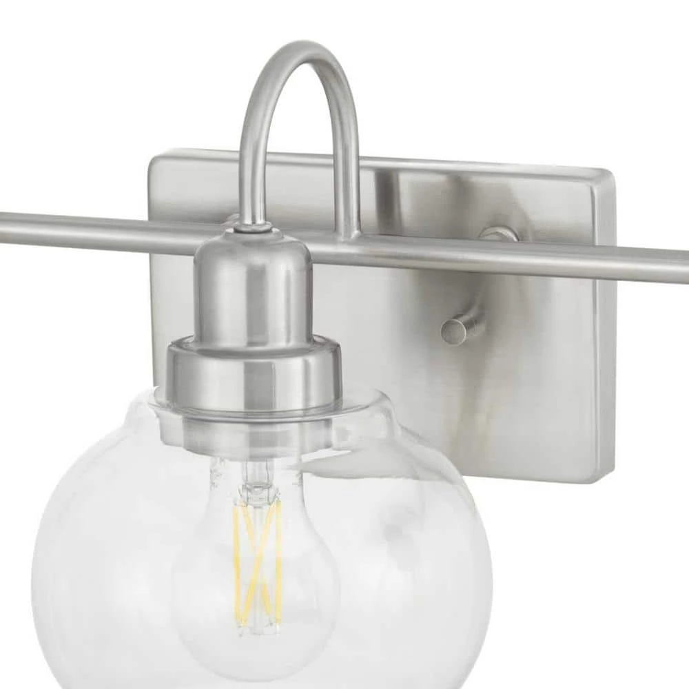 Home Decorators Collection Halyn 23 in. 3-Light Brushed Nickel Bathroom Vanity Light with Clear Glass Shades 10 Home Decorators Collection Halyn 23 in. 3-Light Brushed Nickel Bathroom Vanity Light with Clear Glass Shades - Image 8