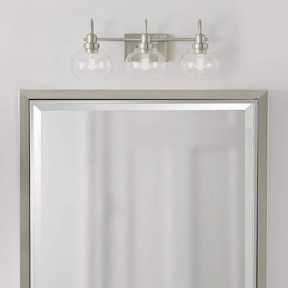 Home Decorators Collection Halyn 23 in. 3-Light Brushed Nickel Bathroom Vanity Light with Clear Glass Shades 4 Home Decorators Collection Halyn 23 in. 3-Light Brushed Nickel Bathroom Vanity Light with Clear Glass Shades - Image 2