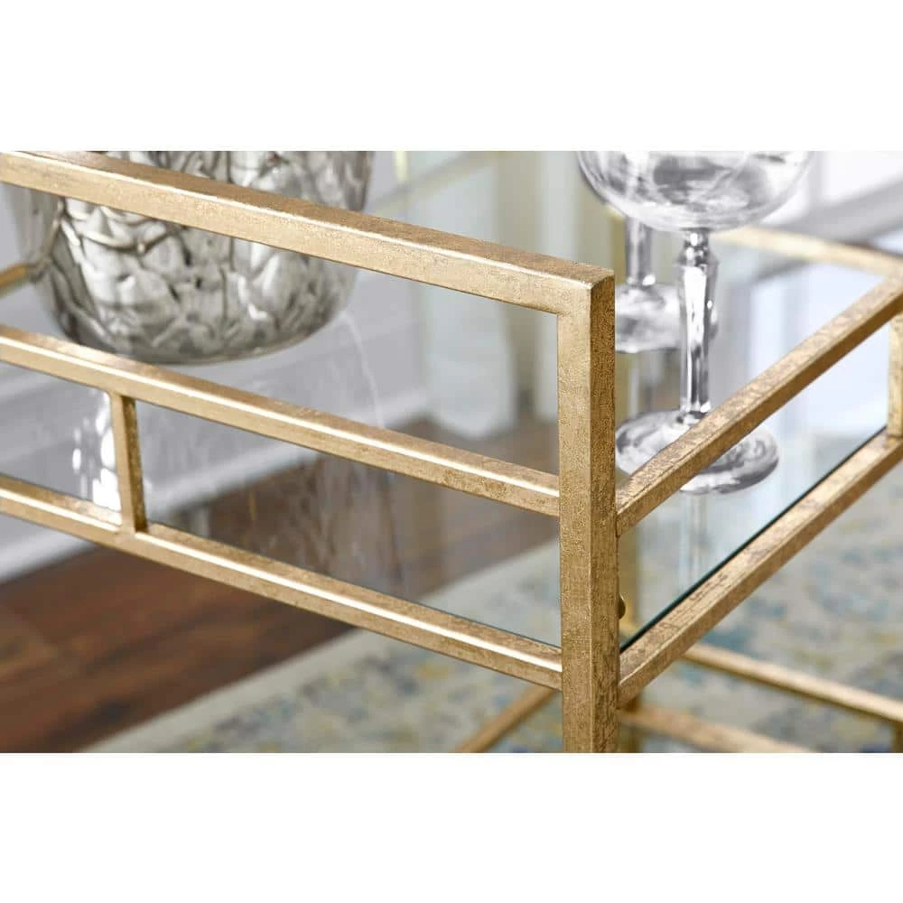 Home Decorators Collection Gold Leaf Metal and Glass Rolling Bar Cart with Glass Top (30 in. W x 33 in. H) 7 Home Decorators Collection Gold Leaf Metal and Glass Rolling Bar Cart with Glass Top (30 in. W x 33 in. H) - Image 5