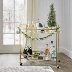 Home Decorators Collection Gold Leaf Metal and Glass Rolling Bar Cart with Glass Top (30 in. W x 33 in. H) 17 Home Decorators Collection Gold Leaf Metal and Glass Rolling Bar Cart with Glass Top (30 in. W x 33 in. H) -Home Decorators Soldes gold leaf home decorators collection bar carts v174814 np 44 1000